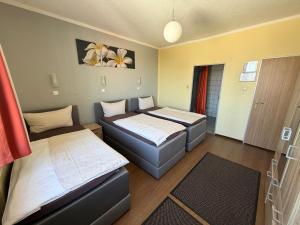Llit o llits en una habitació de Hotel Sieme
