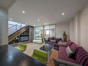 a living room with a couch and a table at Tanger City 5 in Tangier +14 photos