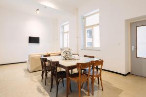 a dining room with a table and chairs at NUMBR25 - self service & low budget Hotel in Graz
