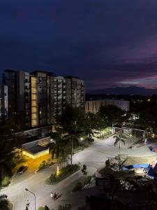 a city at night with buildings and a parking lot at Matina enclaves condo studio type 6thfloor in Davao City
