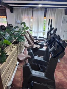a gym with a bunch of exercise bikes in it at Hotel Move Espadan in Azuébar +5 photos