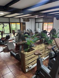 a gym with chairs and exercise equipment in a room at Hotel Move Espadan in Azuébar