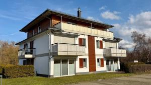 a building with balconies on the side of it at Penthouse Meeresrauschen in Dierhagen