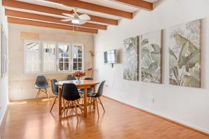 a dining room with a table and chairs at Casa Masi by 3VILLAS in Son Parc