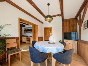 a dining room with a table and chairs at Equus Silvania in Şinca Nouă