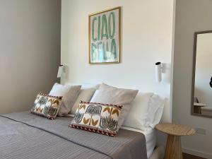 a bedroom with a bed with pillows on it at Casa MauRo in Senigallia