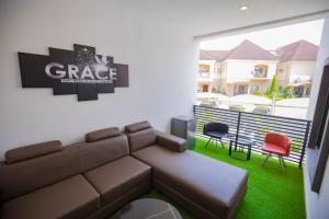 a living room with a couch and two chairs at The Kitchen Kabinet in Abuja