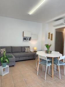 a living room with a couch and a table at Cà par durmì in Gravellona Toce