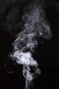 a cloud of smoke on a black background at Fournine Media in Mulanje
