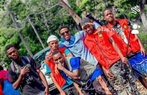 a group of men are posing for a picture at Fournine Media in Mulanje