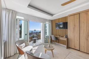 a living room with chairs and a table at Stunning 5-Bed Villa with Private Pool in Manilva