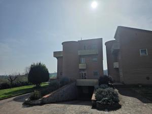 a large brick building with a building at Casa Castellina in Bettolle