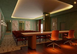 a conference room with a long table and chairs at Palacio San Juan, a Royal Hideaway Hotel in Murcia