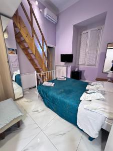 a bedroom with a bed and a staircase in it at Oceania in Genoa