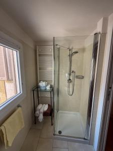 a bathroom with a shower with a glass door at Luxury Apartment in Moltrasio Center in Moltrasio +19 photos