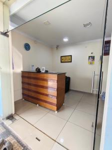 an office with a reception desk in a room at MG Elite Residency in Pondicherry
