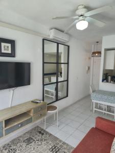 a living room with a large flat screen tv at Bajondillo Beach Apartment By Torremolinos On-line in Torremolinos