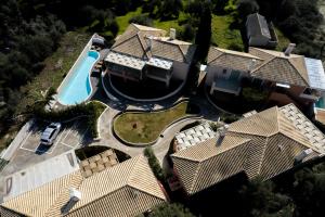 an aerial view of a house with a swimming pool at Ionian Nest Studio in Pogoniá