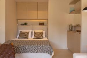 a bedroom with a bed with two pillows on it at Ionian Nest Studio in Pogoniá +9 photos