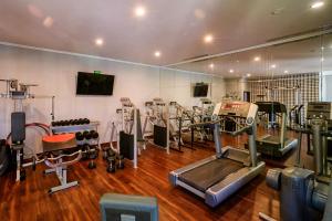 a gym with treadmills and machines in a room at Na Kamieniu Hotel & Spa in Olesno