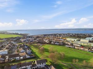 an aerial view of a town with a body of water at Harbour Views in Ferryden