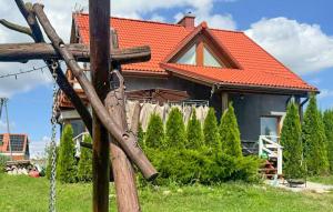 a house with an orange roof and a fence at Stunning Home In Rybical With Wifi in Rybical
