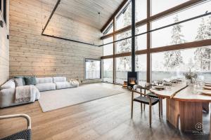a living room with a table and a couch at ConstaVilla by Hilla Villas in Kolari