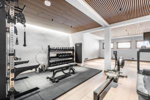 a room with a gym with exercise equipment in it at ConstaVilla by Hilla Villas in Kolari