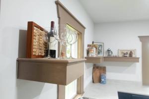 a room with a wine glass on a shelf at ASecondU Peaceful Retreat in Salisbury +20 photos