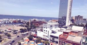 an aerial view of a city with buildings and a street at Suíte panorama histórico in Manaus