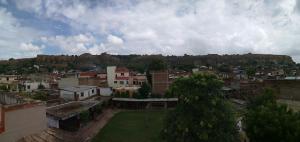 a view of a city with buildings and trees at G d palace in Gwalior