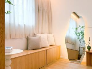 a bathroom with a sink and a window at Euljiro Central 3BR Stay in Seoul