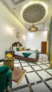 a bedroom with a bed and a tiled floor at Riad Lala Zehra in Fez