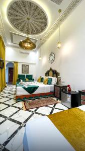 a bedroom with a bed in a room with a ceiling at Riad Lala Zehra in Fez