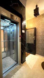 an entrance to a building with a glass door at Appartements Luxe Simo in Fez +100 photos