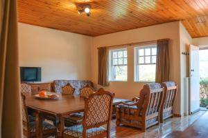 a dining room with a table and chairs at Casa da Avó Lina by Quantique in Vieira do Minho