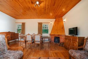 a living room with a table and a fireplace at Casa da Avó Lina by Quantique in Vieira do Minho