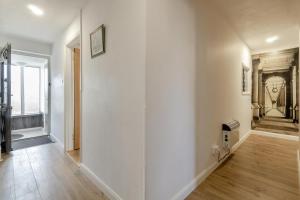 an empty hallway with white walls and wood floors at 3 Bed in Stratford St. Andrew oc-swint in Farnham +25 photos
