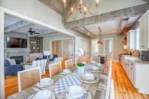 a kitchen and living room with a table and chairs at 233 Glen Abbey in Kiawah Island