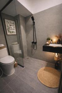 a bathroom with a shower and a toilet and a sink at December homestay studio 002 in Ho Chi Minh City
