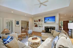 a living room with a couch and a fireplace at 13 Angler Hall in Kiawah Island