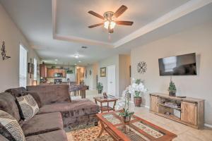a living room with a couch and a ceiling fan at San Antonio Home w/ Hot Tub: Near Golf & Shopping in San Antonio