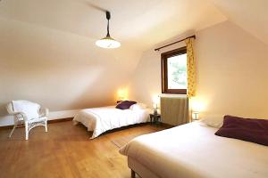 a bedroom with two beds and a window at Pechboutier in Saint-Cyprien +32 photos