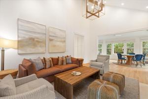 a living room with a couch and a table at 3 Surfsong in Kiawah Island