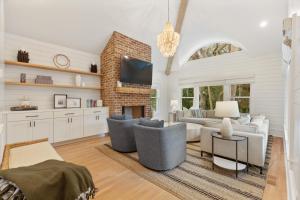 a living room with a couch and a fireplace at 3 Surfsong in Kiawah Island