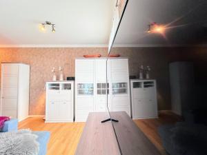 a baseball bat on a table in a room at FeWo RoSi SN in Schwerin +42 photos