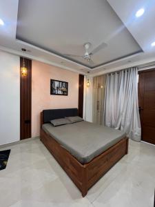 a bedroom with a large bed in a room at 3BHK Independent Floor in New Delhi
