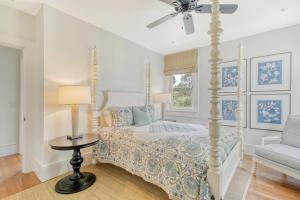 a bedroom with a bed and a ceiling fan at 119 Halona Ln in Kiawah Island +80 photos