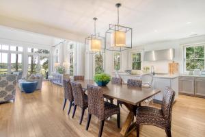 a kitchen and dining room with a table and chairs at 119 Halona Ln in Kiawah Island