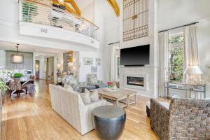 a living room filled with furniture and a tv at 119 Halona Ln in Kiawah Island